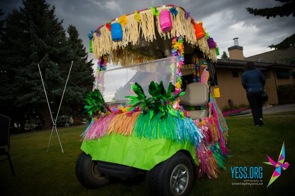 Luau-themed golf cart at the YESS Golf Classic